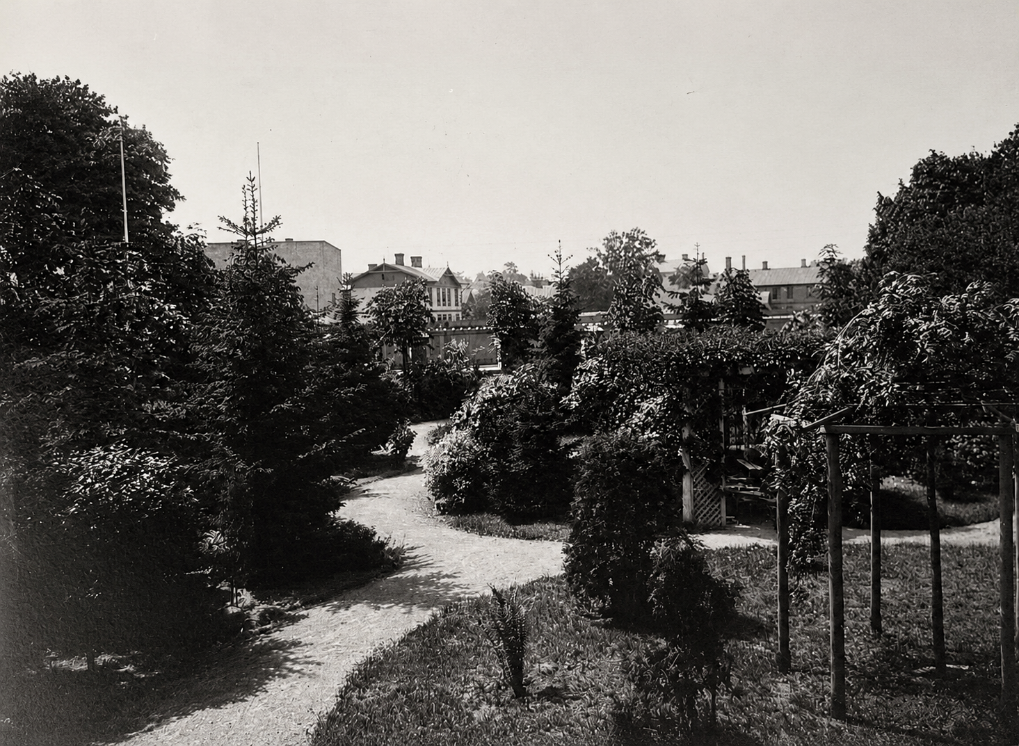 Winding park pathways and pergolas in the estate garden