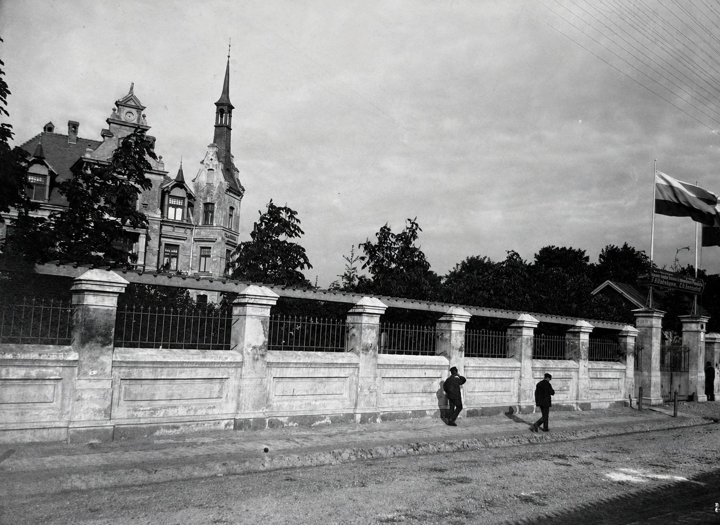 Masonry perimeter wall and street view along Bauskas street